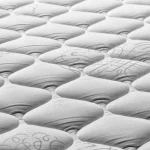 嬰兒透氣床墊推薦 a close up of a mattress that has been made