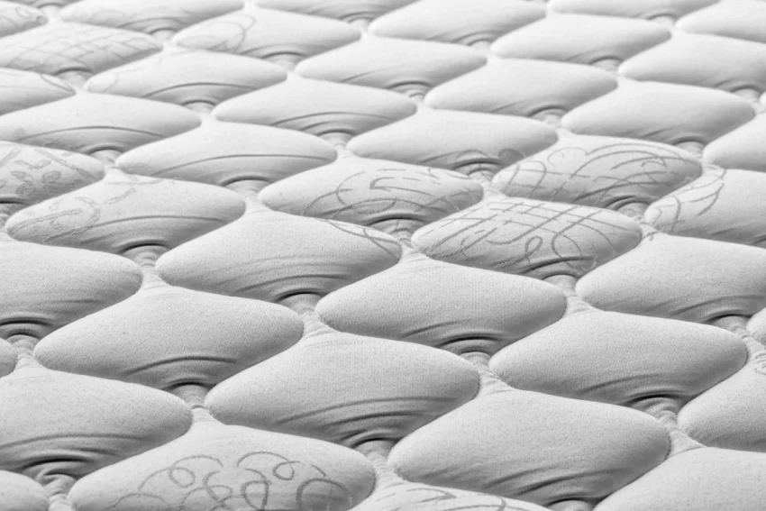 嬰兒透氣床墊推薦 a close up of a mattress that has been made